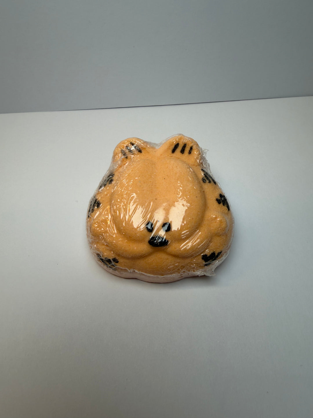 orange cat bath bomb wrapped in clear plastic by BubbleShop