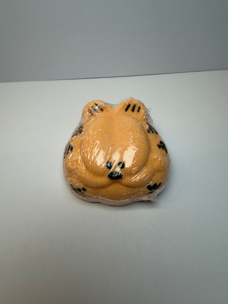 orange cat bath bomb wrapped in clear plastic by BubbleShop