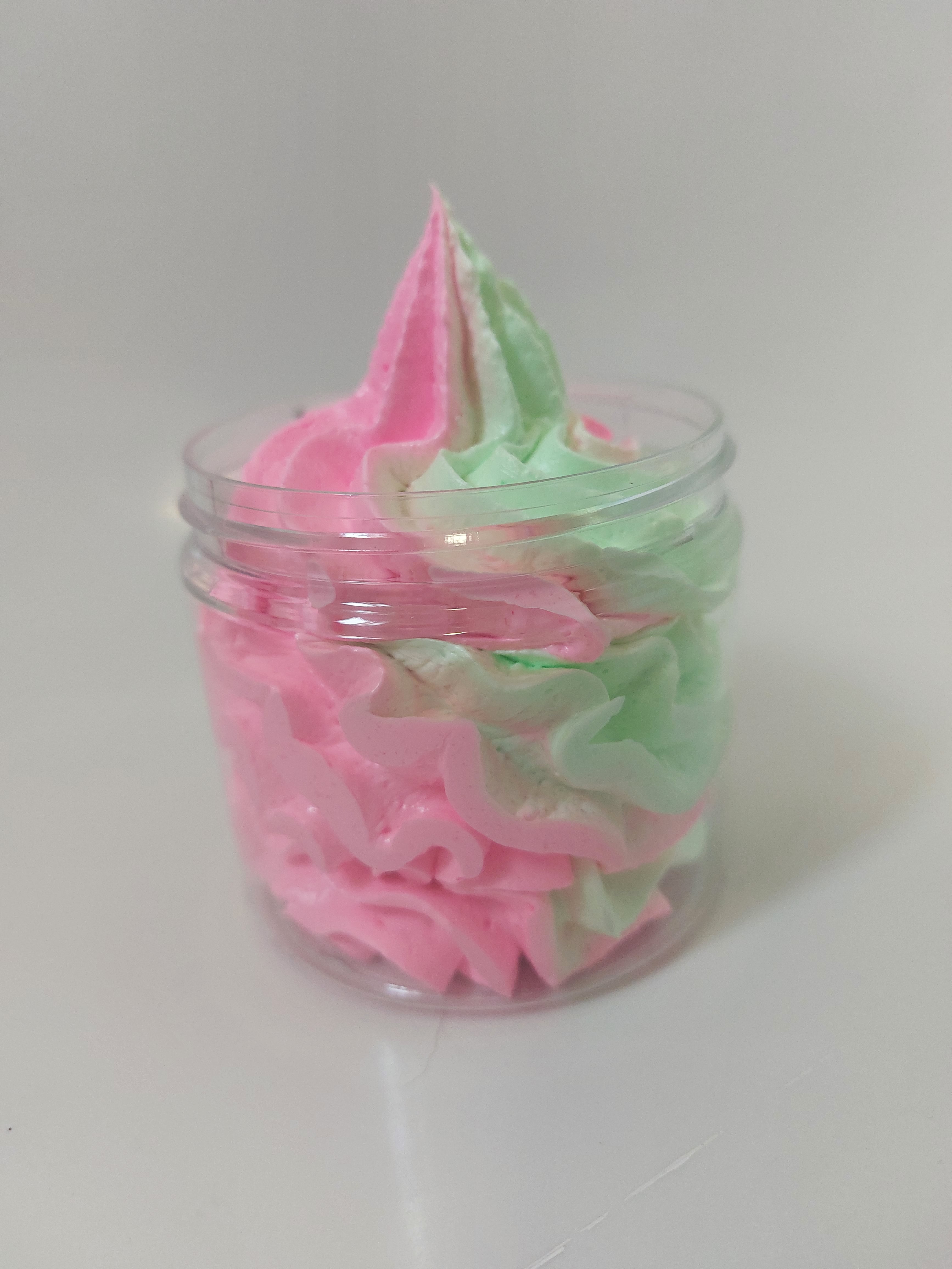 side photo of pink and green whipped soap showing texture and piping of product in Black cherry by bubbleshop
