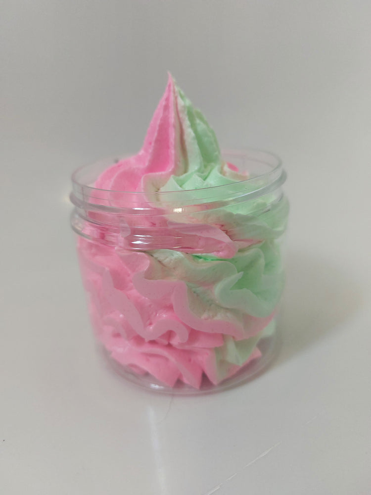 side photo of pink and green whipped soap showing texture and piping of product in Black cherry by bubbleshop