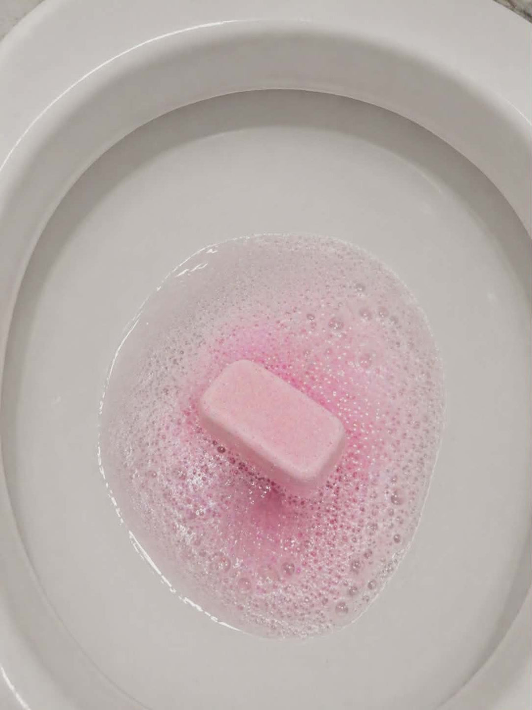 Hibiscus and coconut water mop sink and toilet fizzer by Bubbleshop tropical scented cleaning tablets for home cleaning photo of tablet in toilet working 