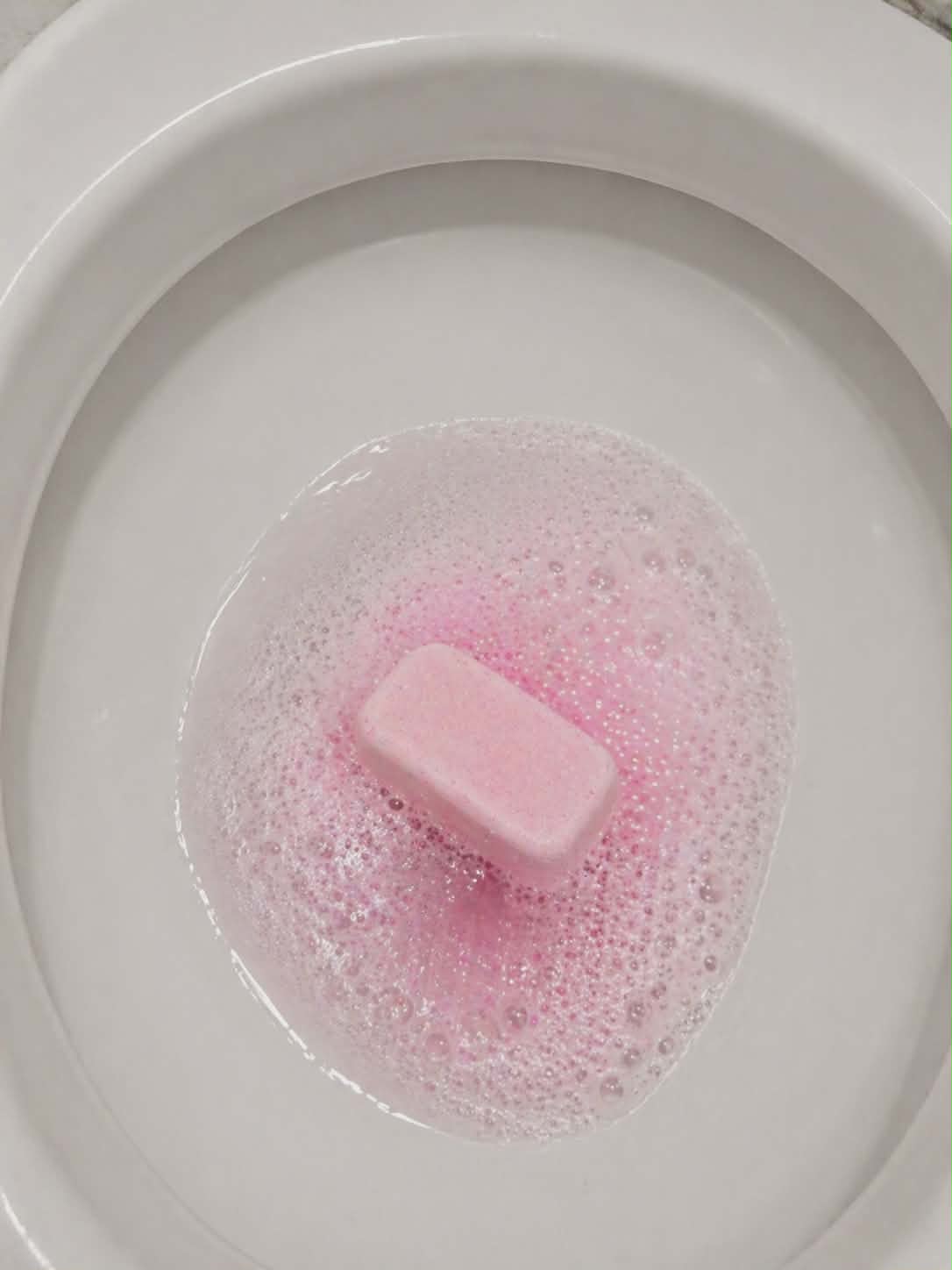Hibiscus and coconut water mop sink and toilet fizzer by Bubbleshop tropical scented cleaning tablets for home cleaning photo of tablet in toilet working 