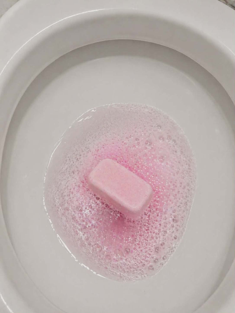 Hibiscus and coconut water mop sink and toilet fizzer by Bubbleshop tropical scented cleaning tablets for home cleaning photo of tablet in toilet working 