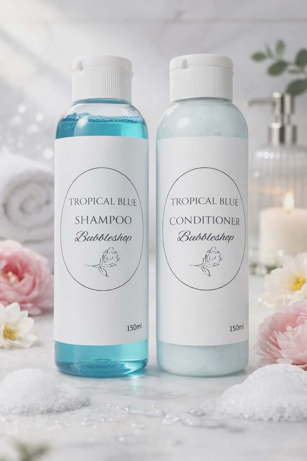 Two bottles of Tropical Blue Shampoo and Conditioner on a decorative background with flowers by BubbleShop
