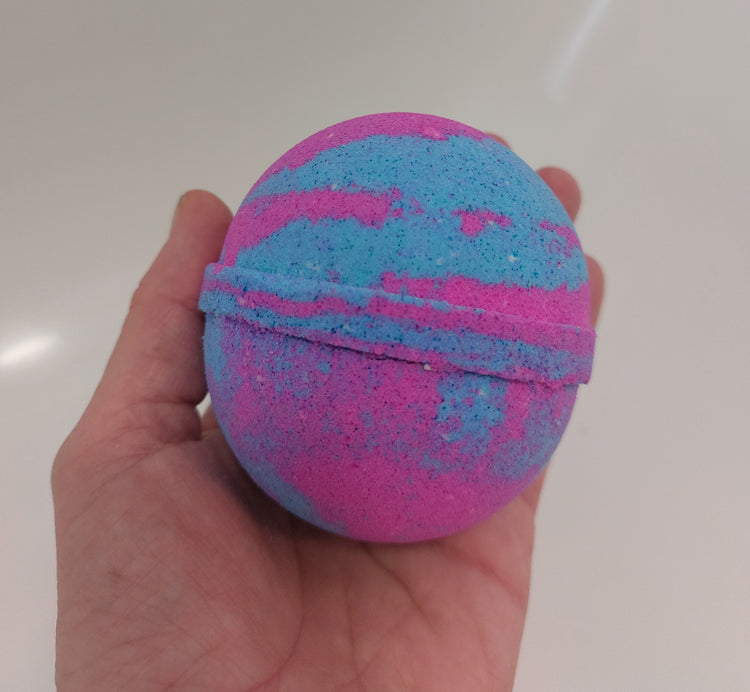 pink and blue large bath bomb in hand to show size in Bubblegum by Bubbleshop