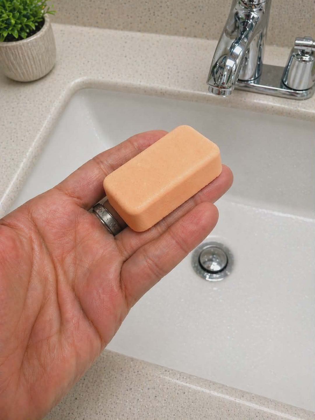 Brust of Sunshine mop sink and toilet fizzers by BubbleShop fresh citrus cleaning tablets for home cleaning photo of orange tablet in hand 