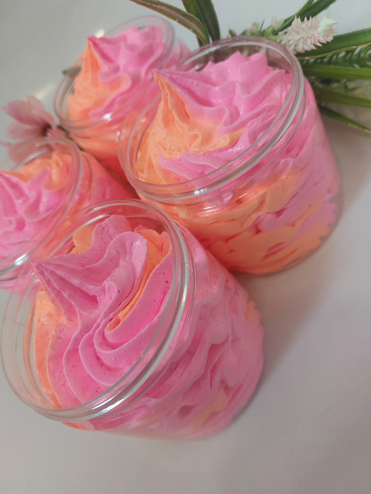 side photo of 4 whipped soap in pink and orange showing texture and piping by BubbleShop  in a perfume inspired fragrance  