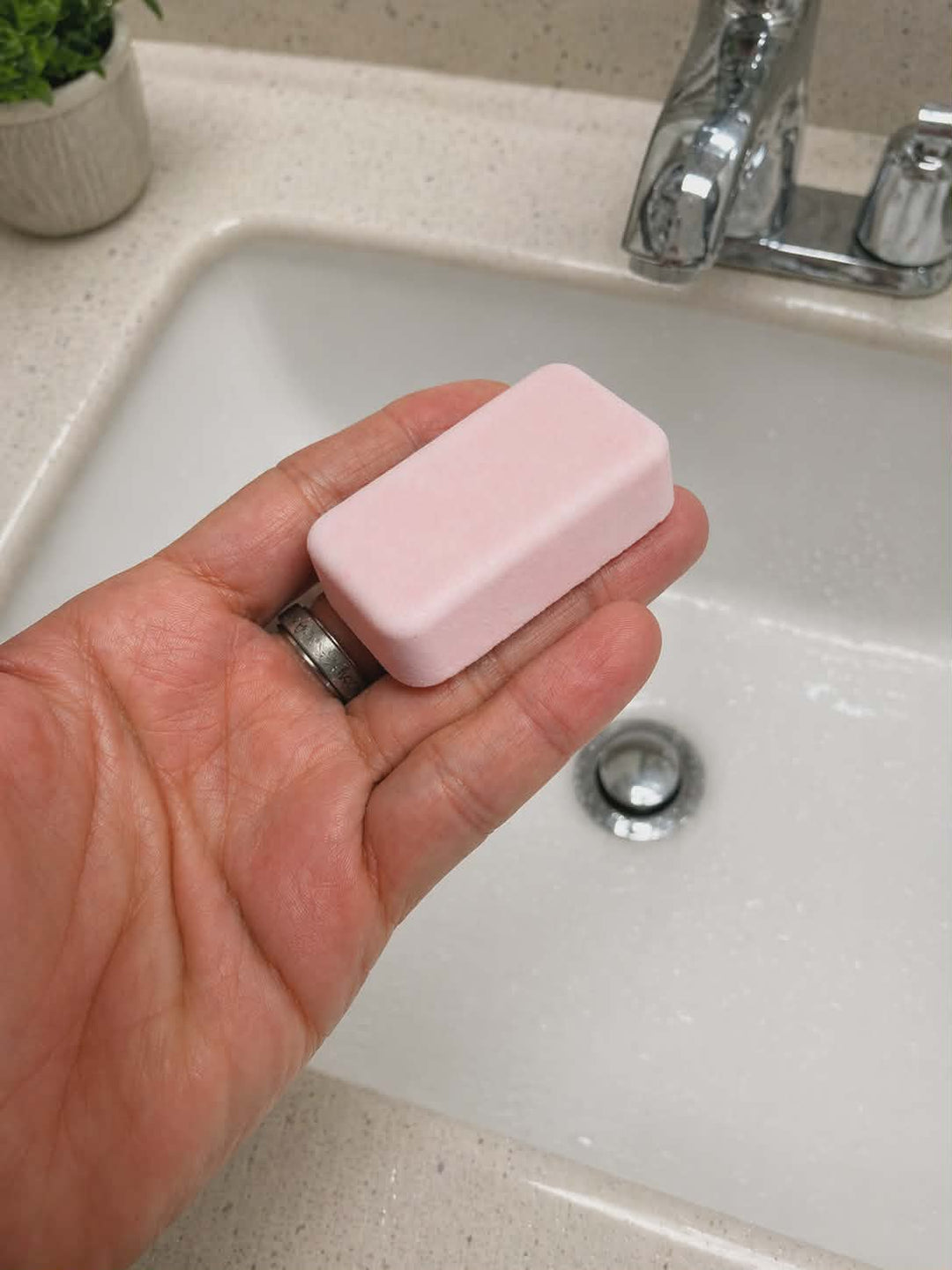 Hibiscus and coconut water mop sink and toilet fizzer by Bubbleshop tropical cleaning tablets for home cleaning photo in hand 