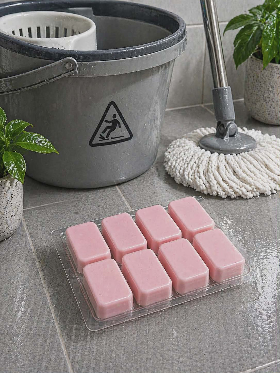 Hibiscus and coconut water mop sink and toilet fizzer by BubbleShop photo next to mop bucket 