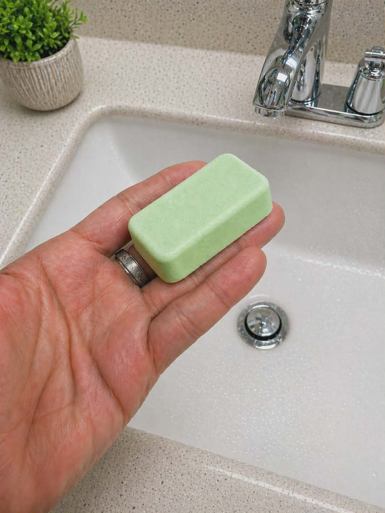Ombre leather mop sink and toilet fizzers by BubbleShop luxury scented cleaning tablets for home cleaning photo of tablet in hand 
