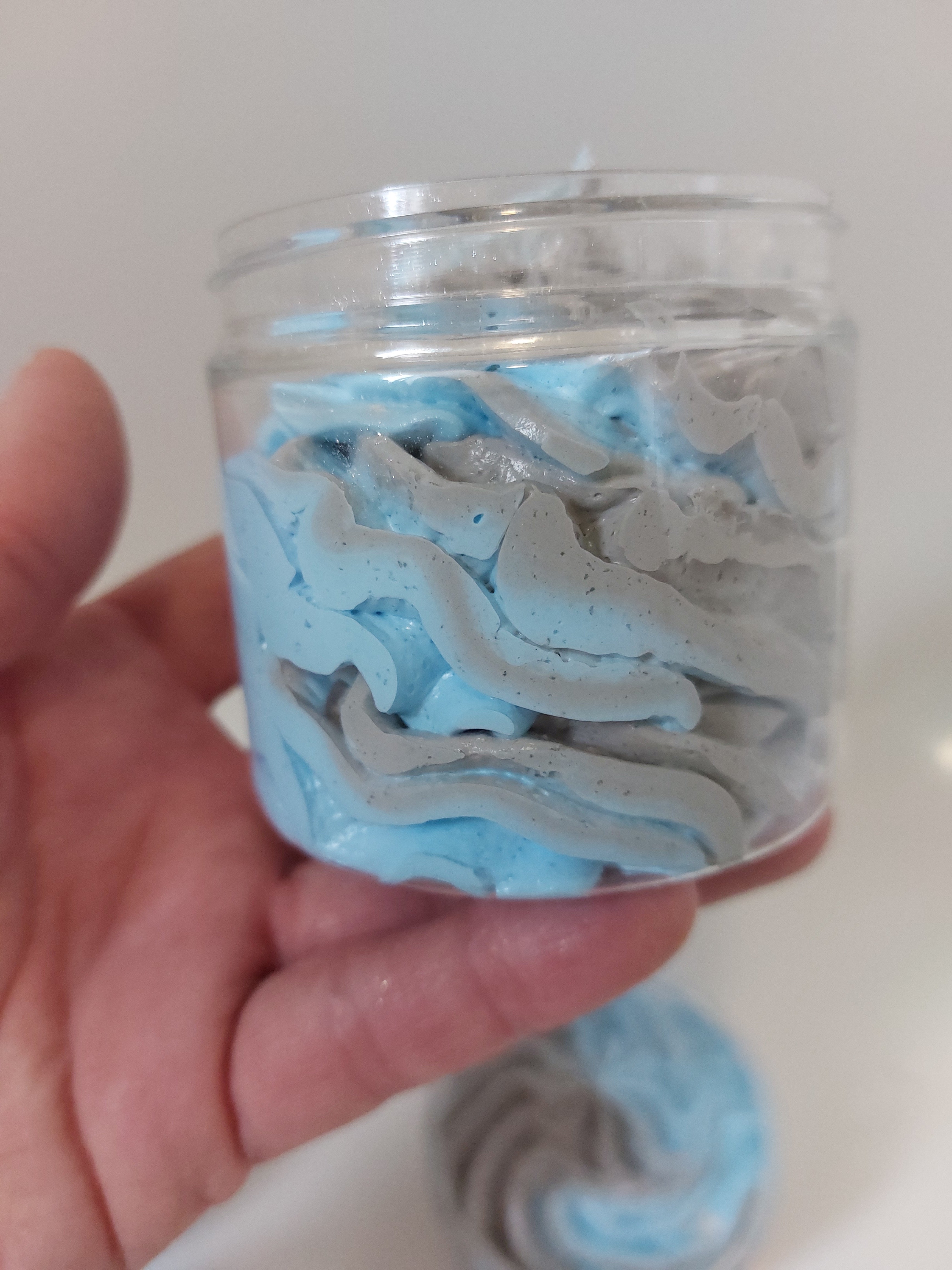 side photo of a pot of blue and grey whipped soap in savage by BubbleShop