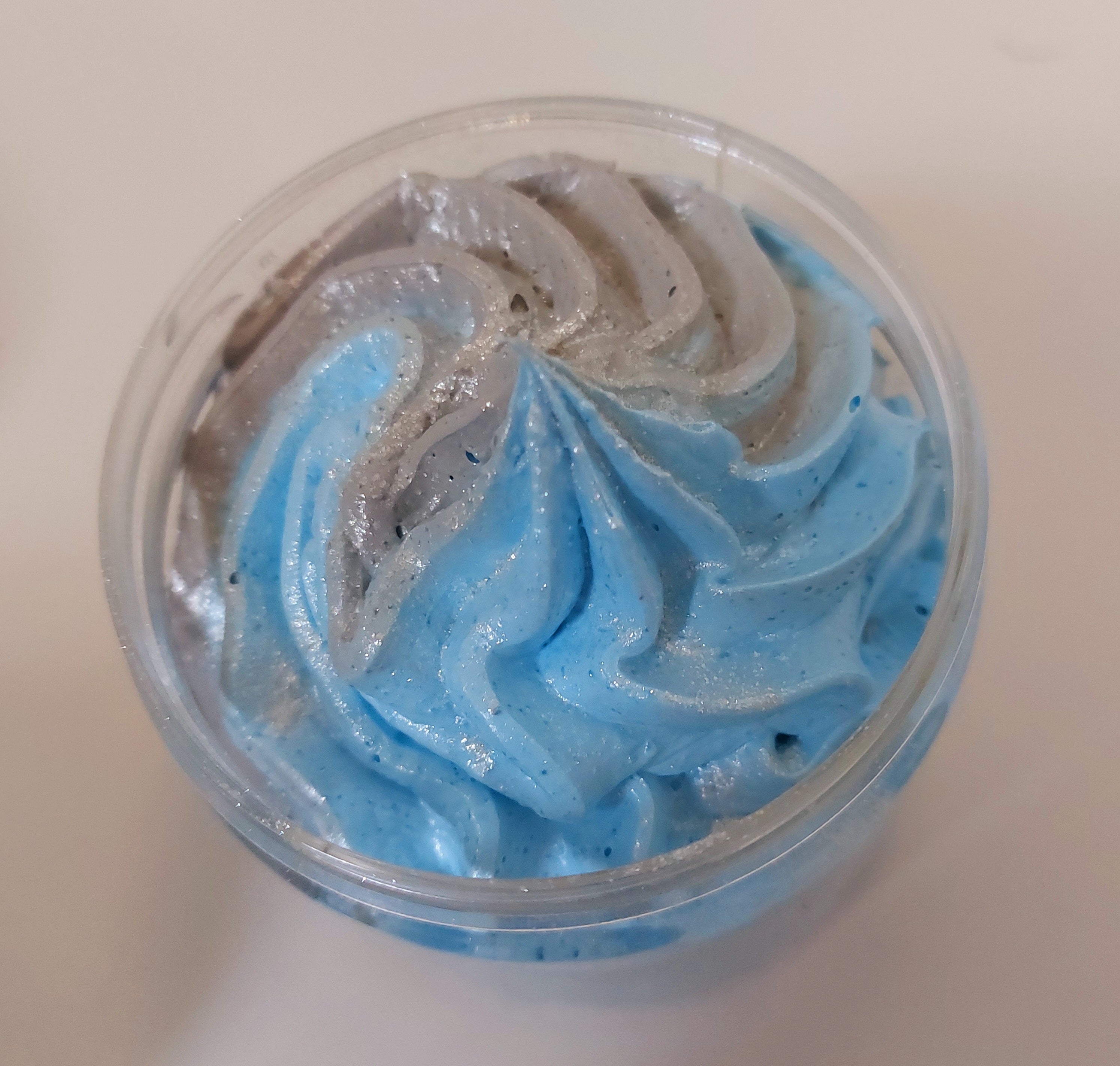photo of the top of a whipped soap pot in blue and grey  to show textures and colours in fragrance savage by BubbleShop