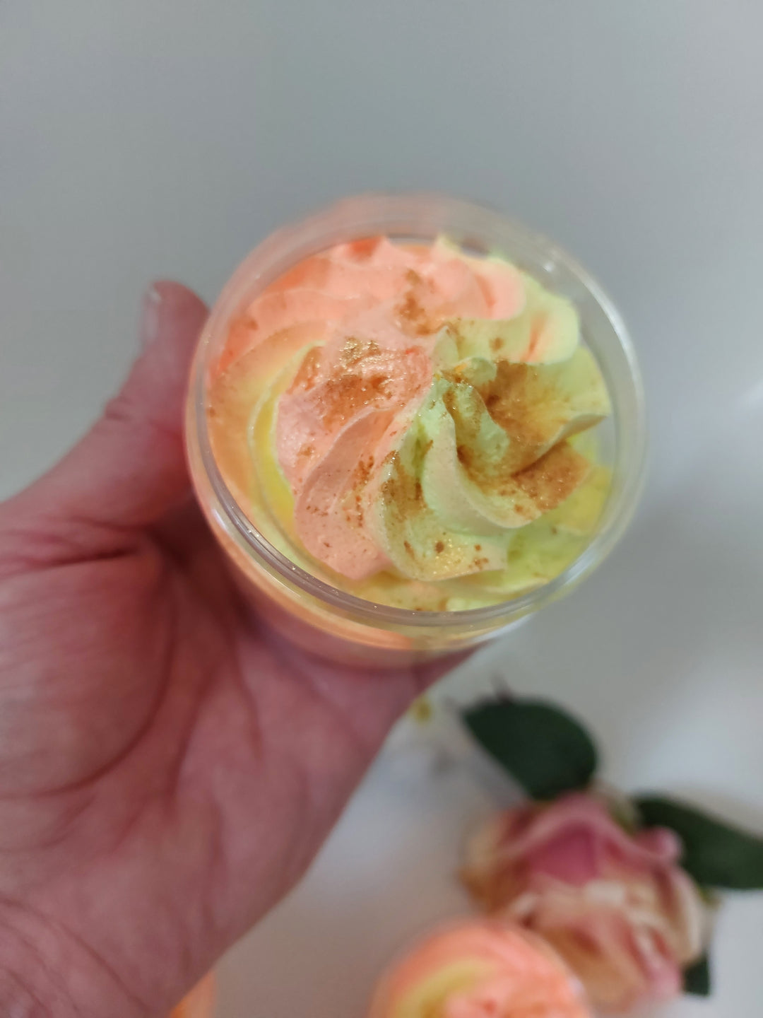 orange and yellow whipped soap in hand to show size in fragrance tropical orange by BubbleShop