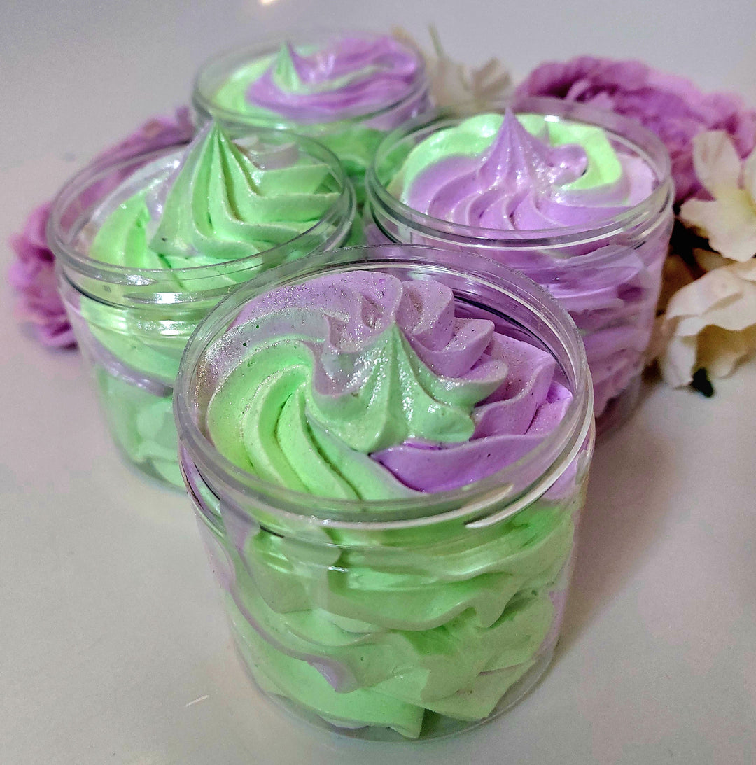 alien inspired whipped soap by  photo of 4 pots in green and purple with a fluffy texture by BubbleShop
