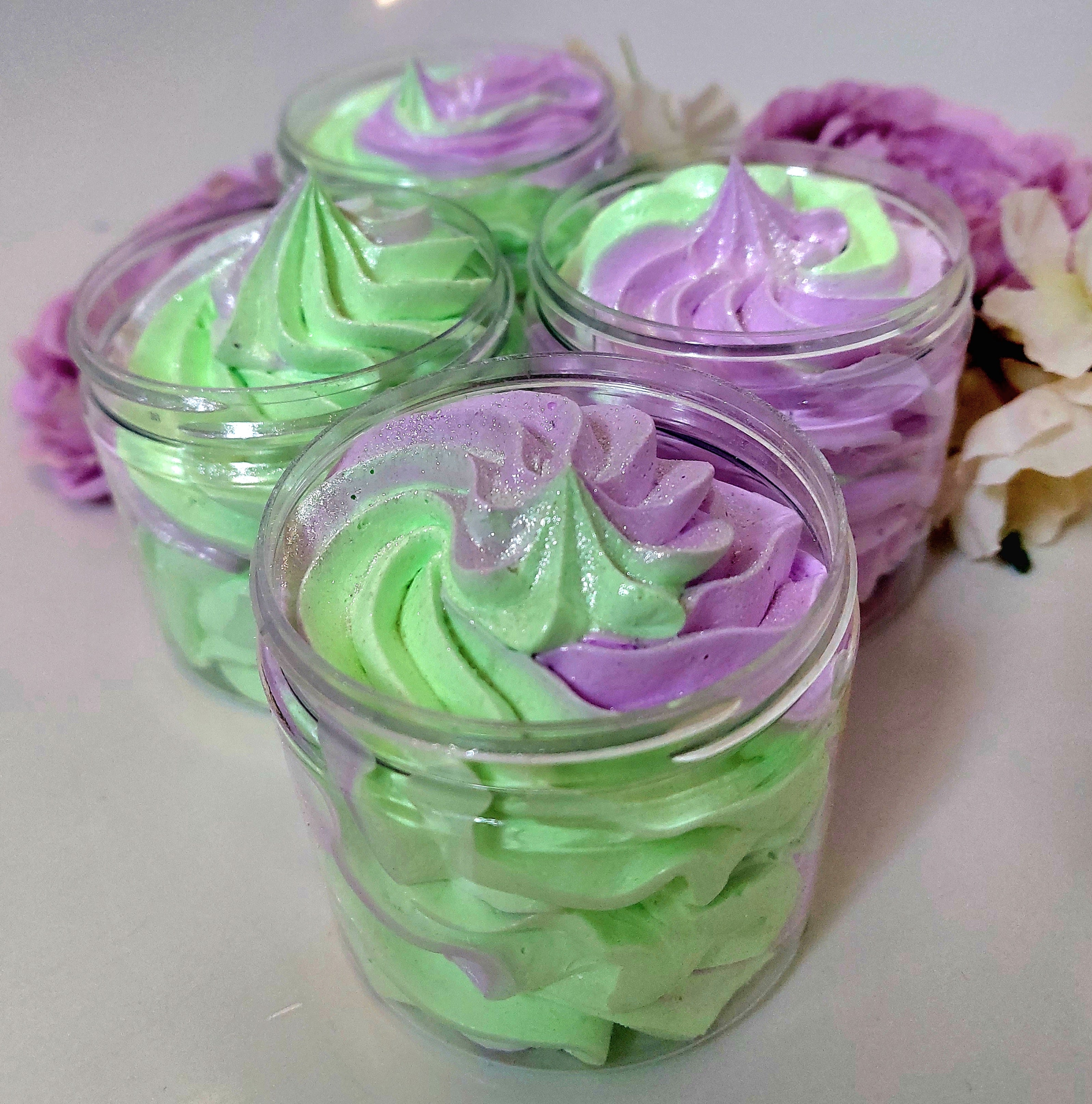 alien inspired whipped soap by  photo of 4 pots in green and purple with a fluffy texture by BubbleShop